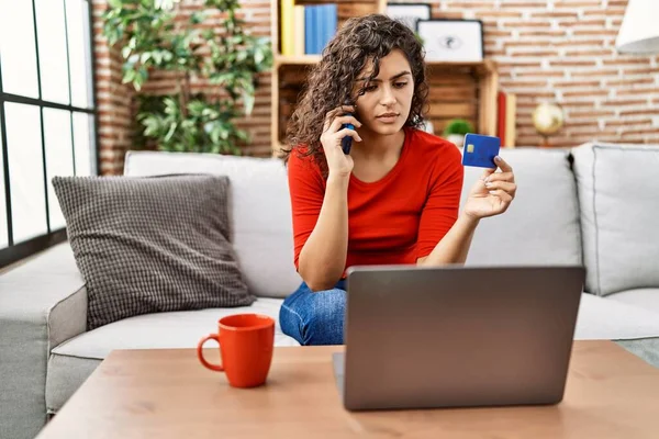 Young Latin Woman Talking Smartphone Using Credit Card Laptop Home — Stock Photo, Image
