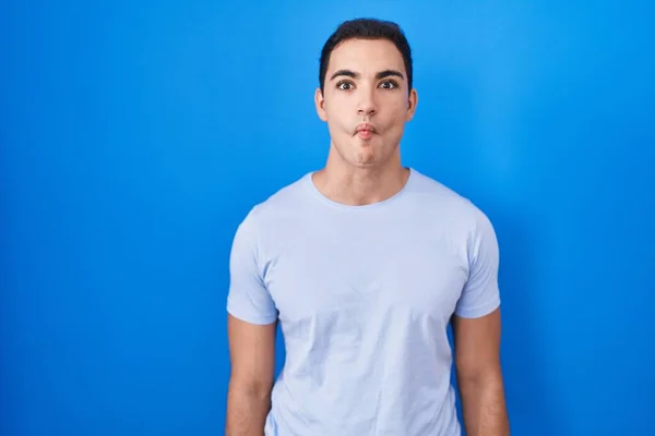 Young Hispanic Man Standing Blue Background Making Fish Face Lips — Foto Stock