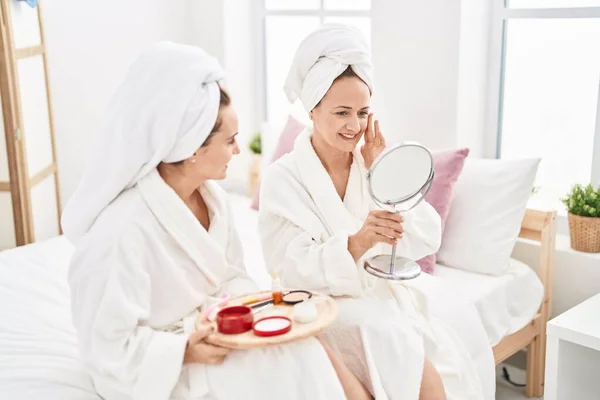 Two Women Mother Daughter Wearing Bathrobe Applying Skin Treatment Bedroom — Foto de Stock
