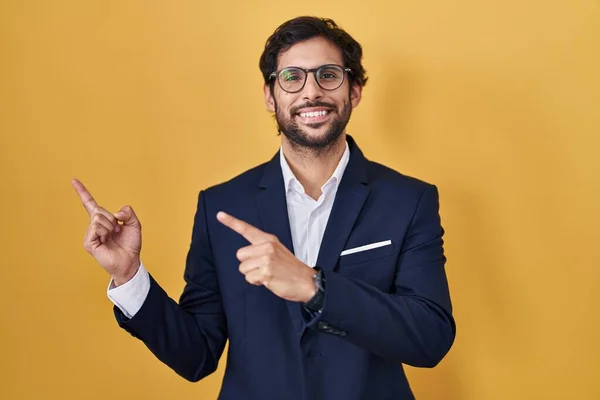Handsome Latin Man Standing Yellow Background Smiling Looking Camera Pointing — Stock Photo, Image
