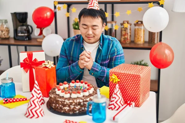 Young Chinese Man Celebrating Birthday Sitting Table Home — ストック写真
