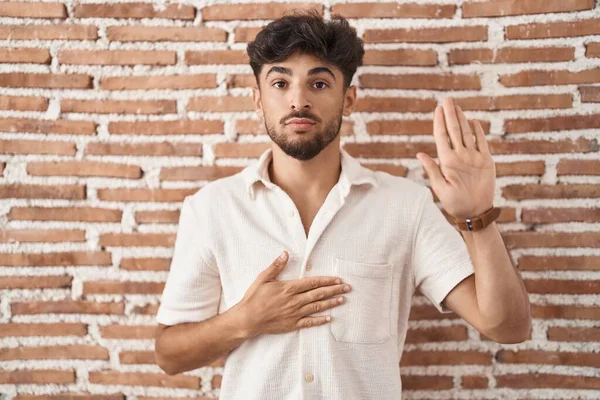 Arab Man Beard Standing Bricks Wall Background Swearing Hand Chest — Stock Photo, Image