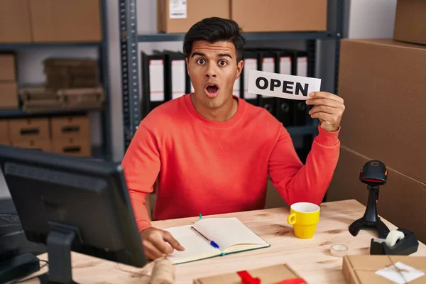 Hispanic Man Working Small Business Ecommerce Holding Open Banner Scared — Stock Photo, Image