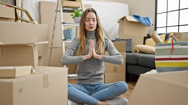 Young Caucasian Woman Doing Yoga Exercise Sitting Floor New Home — Foto de Stock