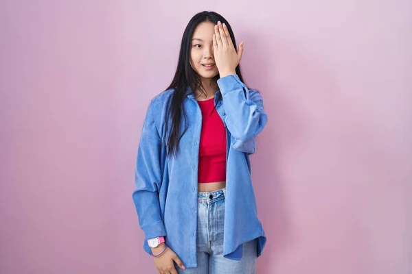 Young Asian Woman Standing Pink Background Covering One Eye Hand — Stok fotoğraf