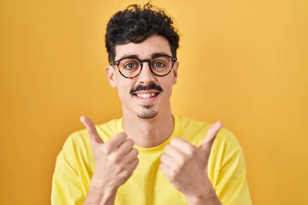 Hispanic Man Wearing Glasses Standing Yellow Background Success Sign Doing — Stock Photo, Image