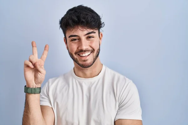 Hispanic Man Beard Standing White Background Smiling Happy Face Winking —  Fotos de Stock