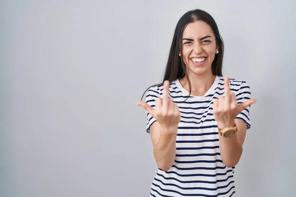 Young Brunette Woman Wearing Striped Shirt Showing Middle Finger Doing — Stockfoto