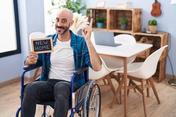 Hispanic Man Beard Sitting Wheelchair New Home Smiling Happy Pointing — Stock Photo, Image