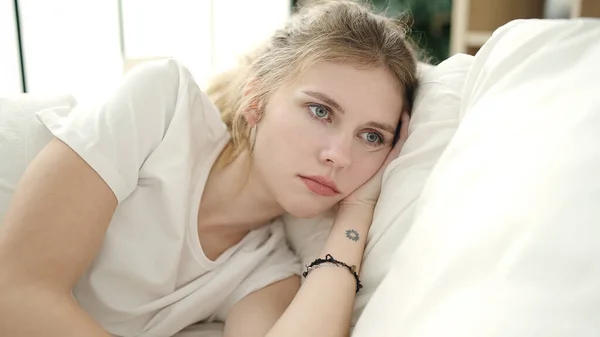 Young Blonde Woman Lying Bed Sad Expression Bedroom — Stock fotografie