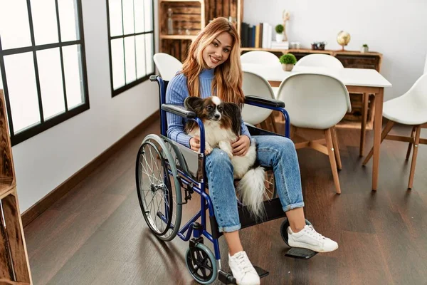Young Caucasian Woman Sitting Wheelchair Touching Dog Home — Stock Fotó