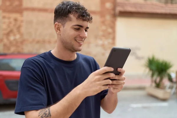 Young Hispanic Man Smiling Confident Using Touchpad Street — Stok fotoğraf