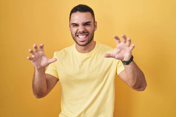 Young Hispanic Man Standing Yellow Background Smiling Funny Doing Claw — 스톡 사진