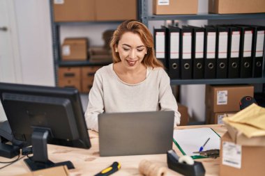 Young woman ecommerce busines worker using laptop working at office