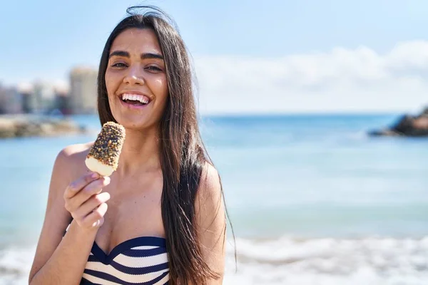 Young Hispanic Woman Wearing Bikini Eating Ice Cream Seaside — Stockfoto