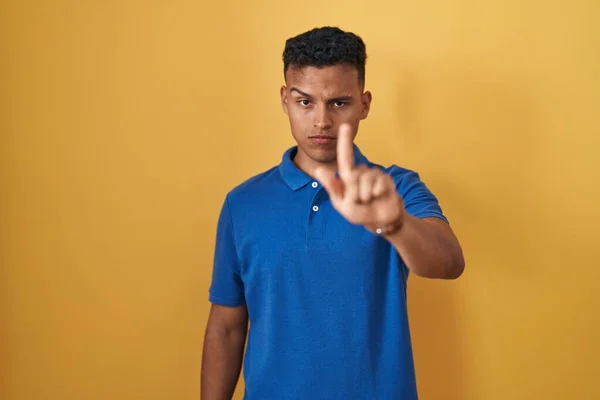 Young Hispanic Man Standing Yellow Background Pointing Finger Angry Expression — Stock Photo, Image