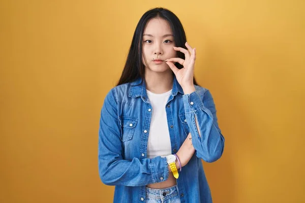 Young Asian Woman Standing Yellow Background Mouth Lips Shut Zip — Stock Photo, Image