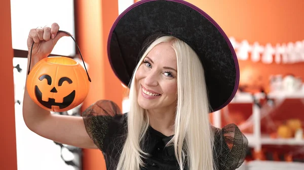 Young Blonde Woman Wearing Witch Costume Holding Halloween Pumpkin Basket — 스톡 사진