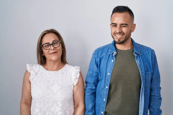 Hispanic Mother Son Standing Together Winking Looking Camera Sexy Expression — Stockfoto