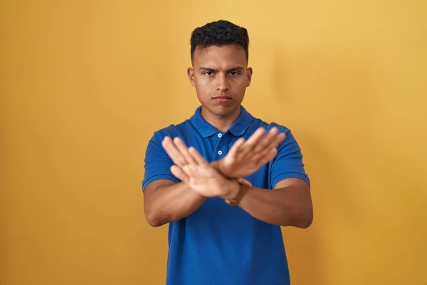 Young Hispanic Man Standing Yellow Background Rejection Expression Crossing Arms — Stock Photo, Image