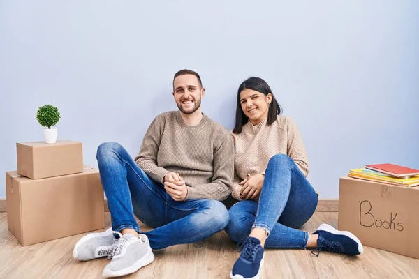Young Couple Moving New Home Hands Together Crossed Fingers Smiling — Stock Photo, Image