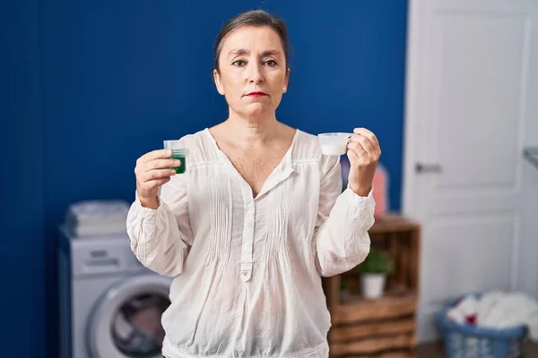 Middle Age Hispanic Woman Holding Laundry Detergent Laundry Powder Relaxed — Stock Photo, Image