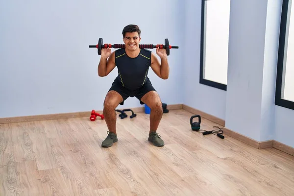 Young Hispanic Man Smiling Confident Using Bar Disc Training Sport — Fotografia de Stock
