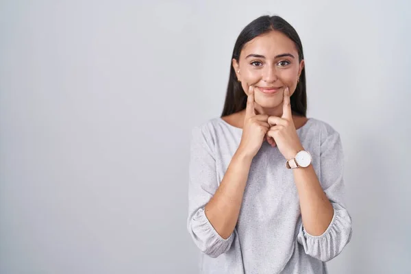 Young Hispanic Woman Standing White Background Smiling Open Mouth Fingers — Photo