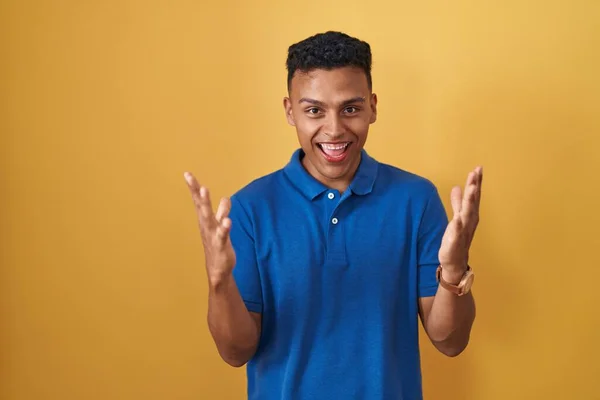 Young Hispanic Man Standing Yellow Background Celebrating Mad Crazy Success — Stock Photo, Image