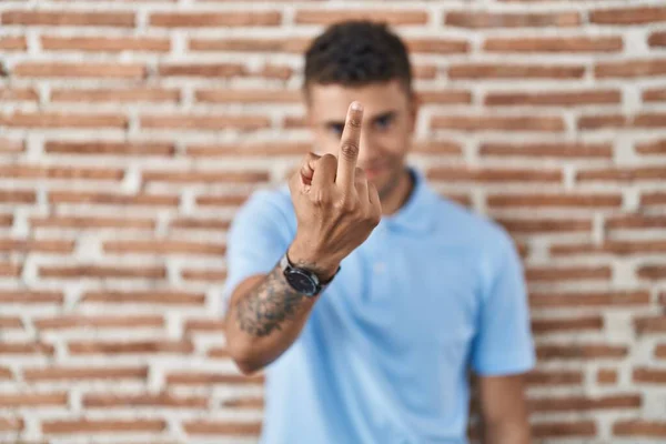 Brazilian Young Man Standing Brick Wall Showing Middle Finger Impolite — Fotografia de Stock