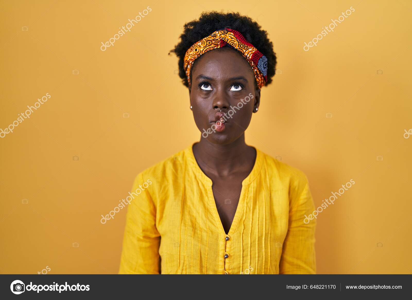 African Young Woman Wearing African Turban Making Fish Face Lips Stock  Photo by ©Krakenimages.com 648221170