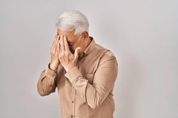Hispanic Senior Man Wearing Glasses Sad Expression Covering Face Hands — Stockfoto