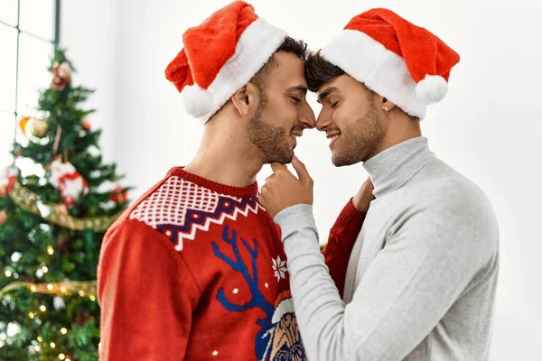 Two Hispanic Men Couple Hugging Each Other Standing Christmas Tree — ストック写真