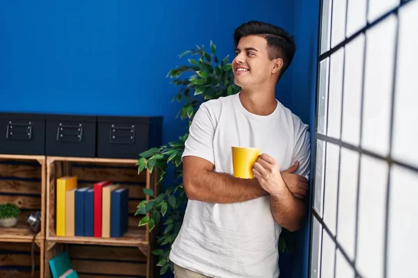 Young Hispanic Man Drinking Coffee Standing Home — Stockfoto