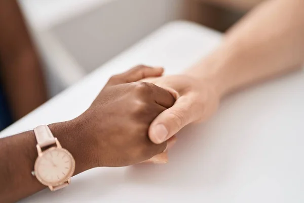 stock image Man and woman interracial couple with hands together at home
