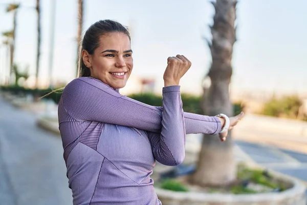 Young Beautiful Hispanic Woman Wearing Sportswear Stretching Arm Street — Stock Photo, Image