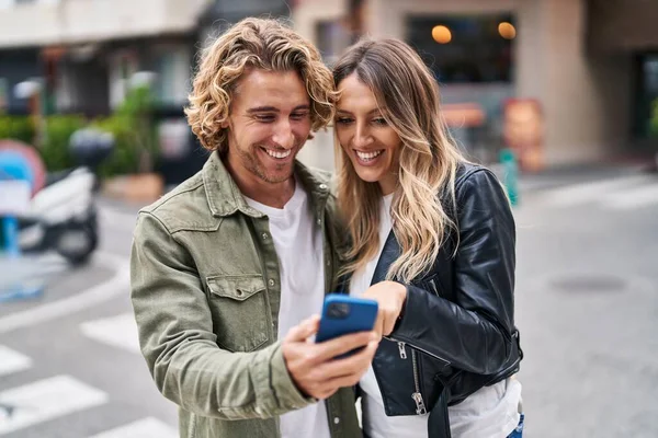 Man Woman Couple Smiling Confident Using Smartphone Street — Stok fotoğraf