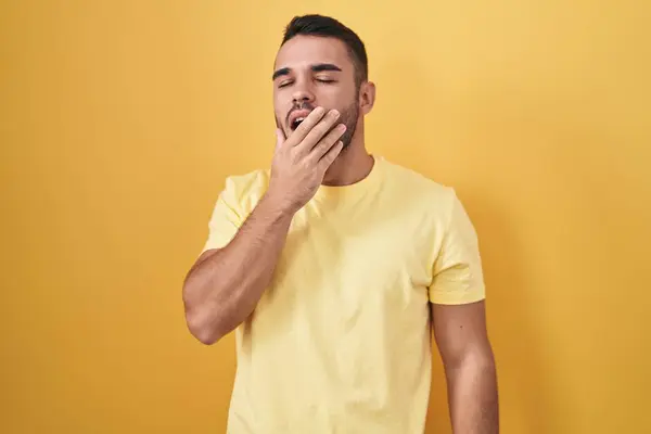 Young Hispanic Man Standing Yellow Background Bored Yawning Tired Covering — Stock Photo, Image