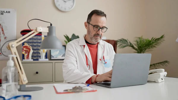 stock image Middle age man wearing call center agent headset working from home celebrating achievement with happy smile and winner expression with raised hand 