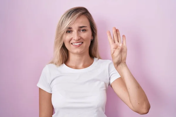 Young Blonde Woman Standing Pink Background Showing Pointing Fingers Number — Stock Photo, Image