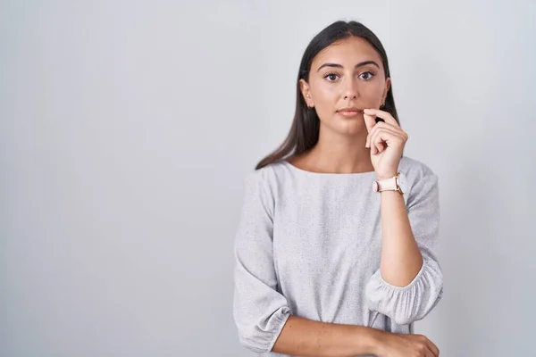 Young Hispanic Woman Standing White Background Mouth Lips Shut Zip — стоковое фото