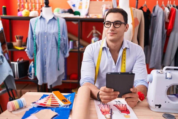 Young Hispanic Man Tailor Smiling Confident Using Touchpad Atelier —  Fotos de Stock