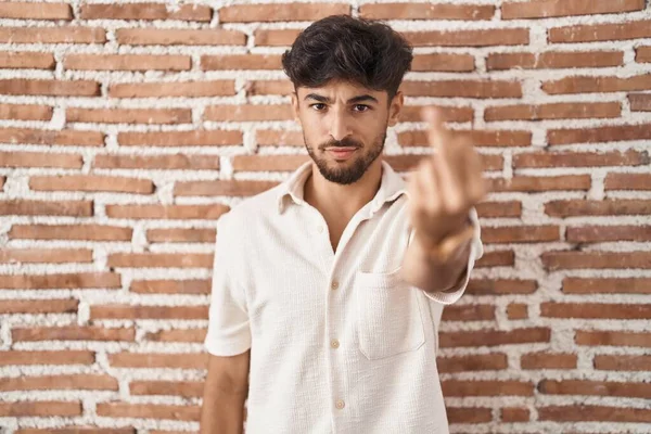 Arab Man Beard Standing Bricks Wall Background Showing Middle Finger — Stockfoto