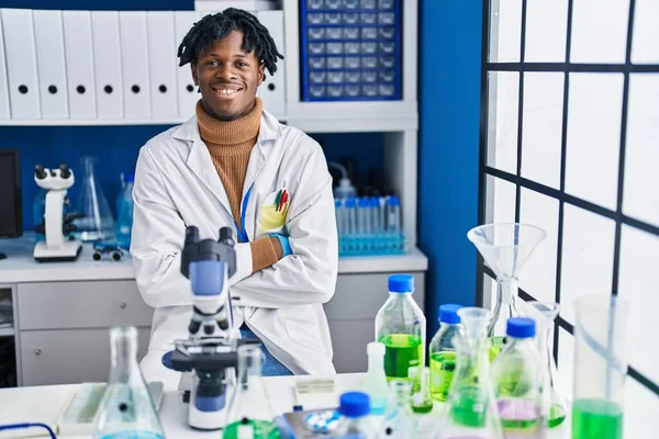 African American Man Scientist Sitting Arms Crossed Gesture Laboratory — Stock Photo, Image