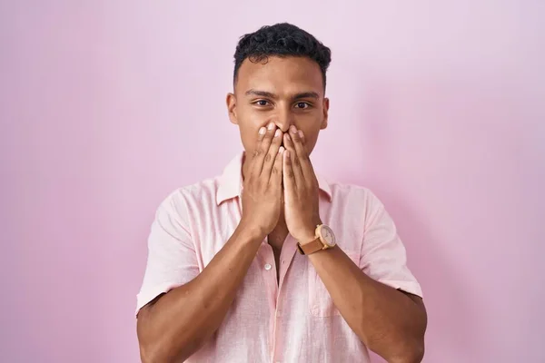 Young Hispanic Man Standing Pink Background Laughing Embarrassed Giggle Covering — Stok fotoğraf