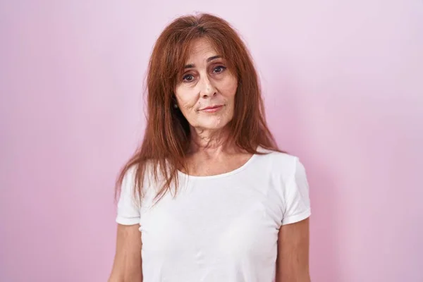 Middle Age Woman Standing Pink Background Relaxed Serious Expression Face — Stock fotografie