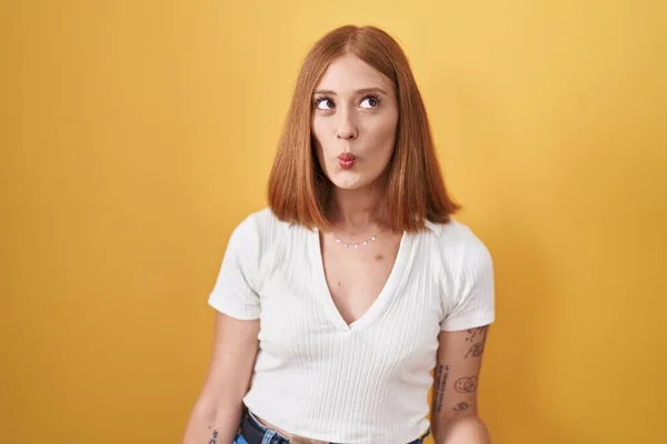 Young Redhead Woman Standing Yellow Background Making Fish Face Lips — Stock Photo, Image