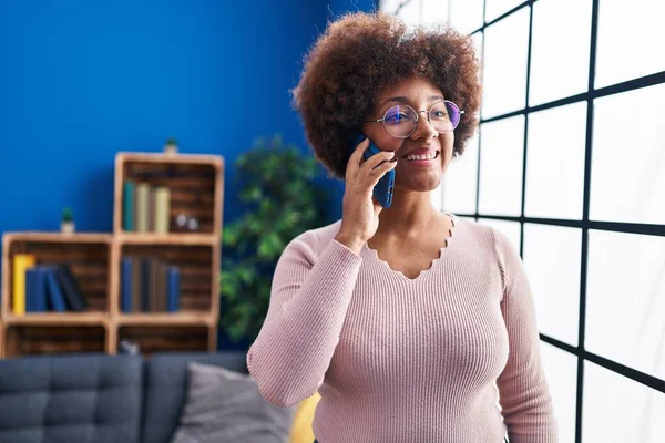 African American Woman Smiling Confident Talking Smartphone Home — стоковое фото