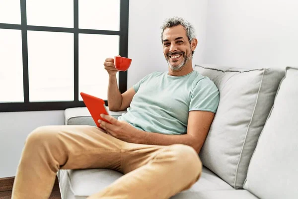Middle Age Grey Haired Man Using Touchpad Drinking Coffee Sitting —  Fotos de Stock