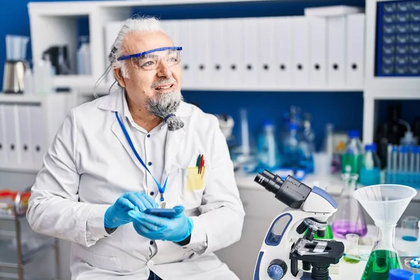 Middle Age Grey Haired Man Scientist Smiling Confident Using Smartphone — ストック写真